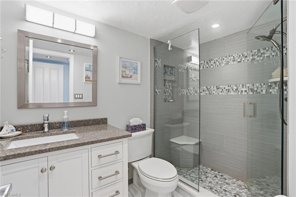 Bathroom with vanity and a shower stall - Virtually Edited Image