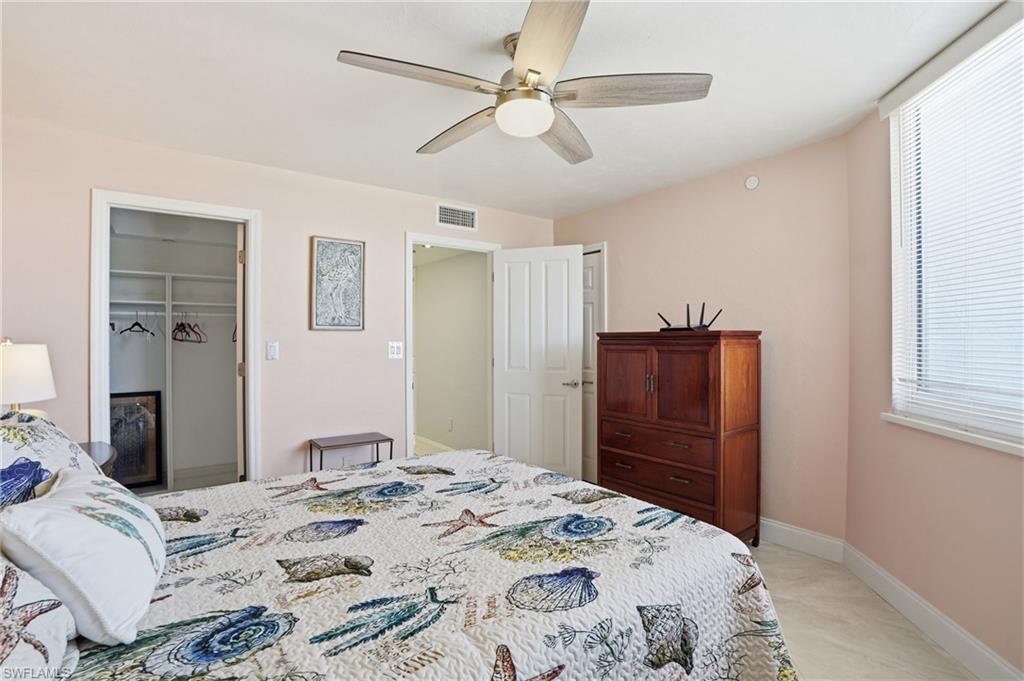 Bedroom featuring a ceiling fan and a walk in closet - Virtually Edited Image