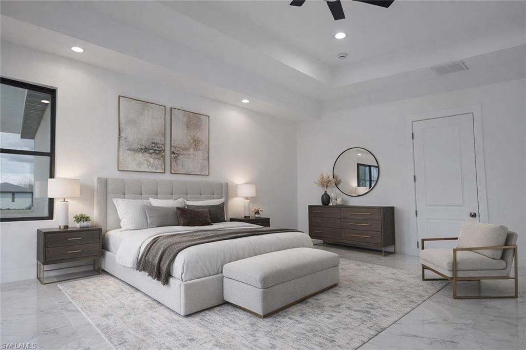 Bedroom with a ceiling fan, a tray ceiling, and recessed lighting