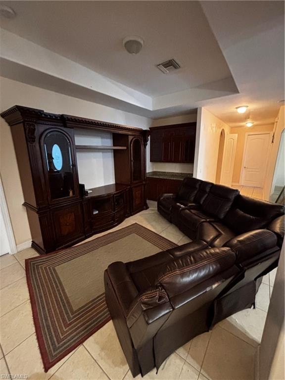 Home theater featuring light tile patterned floors