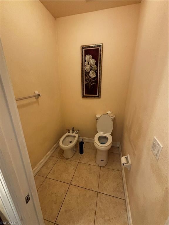Bathroom featuring light tile patterned floors and a bidet