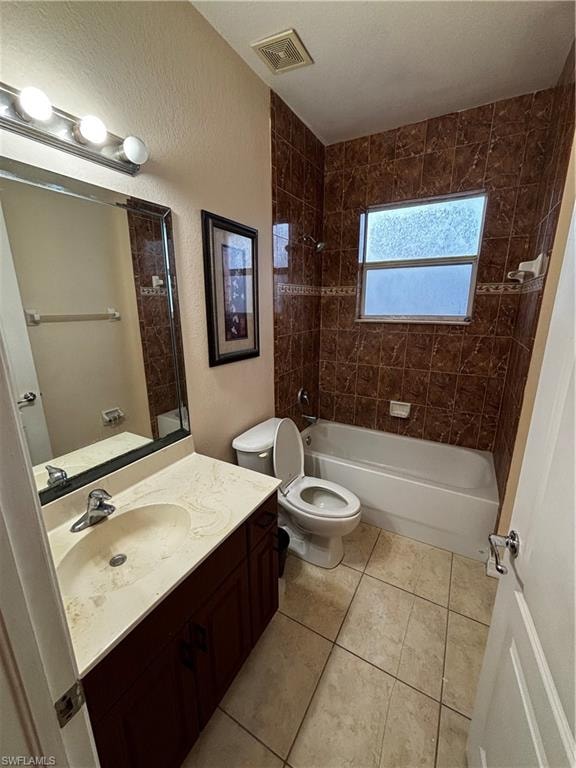 Full bathroom featuring vanity, shower / washtub combination, a textured wall, and light tile patterned floors