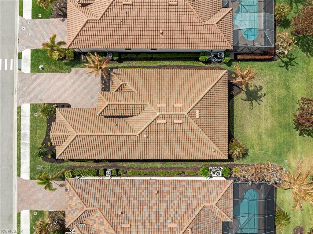 Aerial view of property and surrounding area featuring a pool