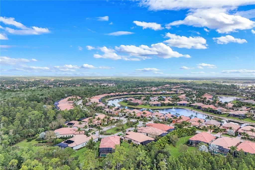 Aerial perspective of suburban area with a nearby body of water