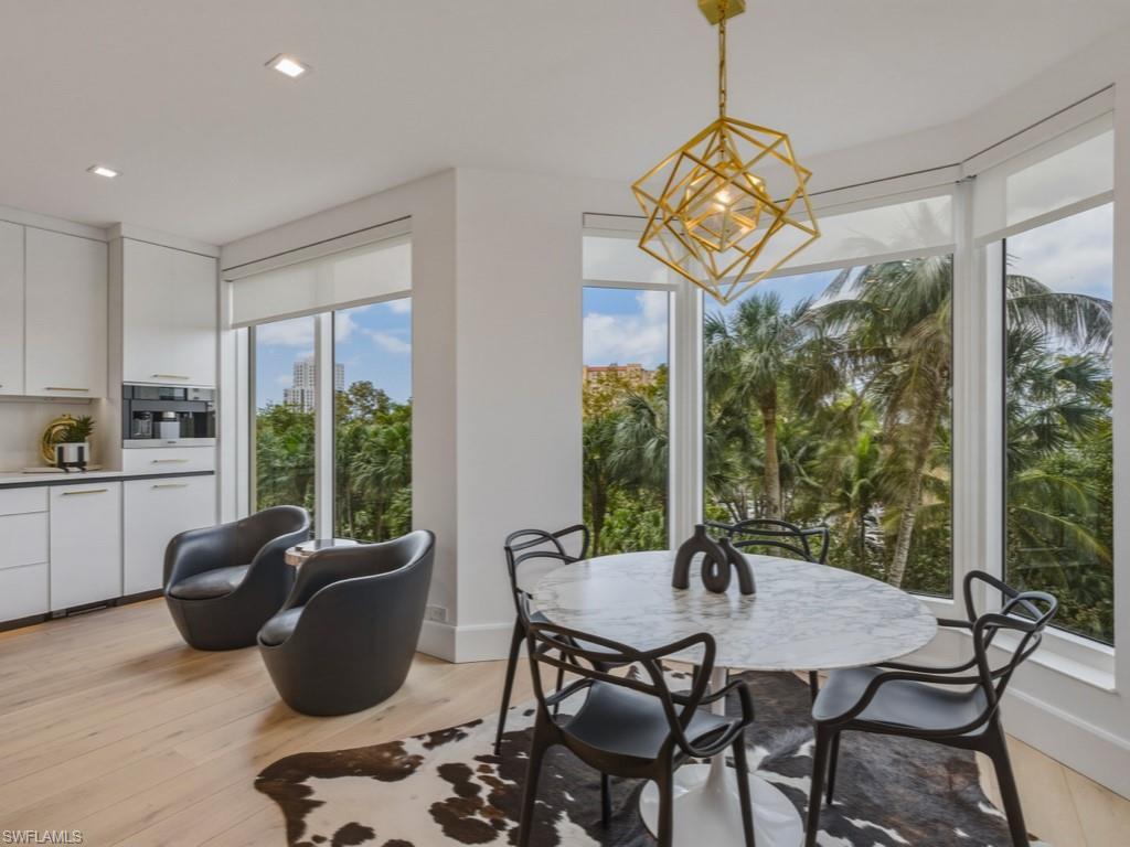 Dining space featuring light wood-style floors and a chandelier