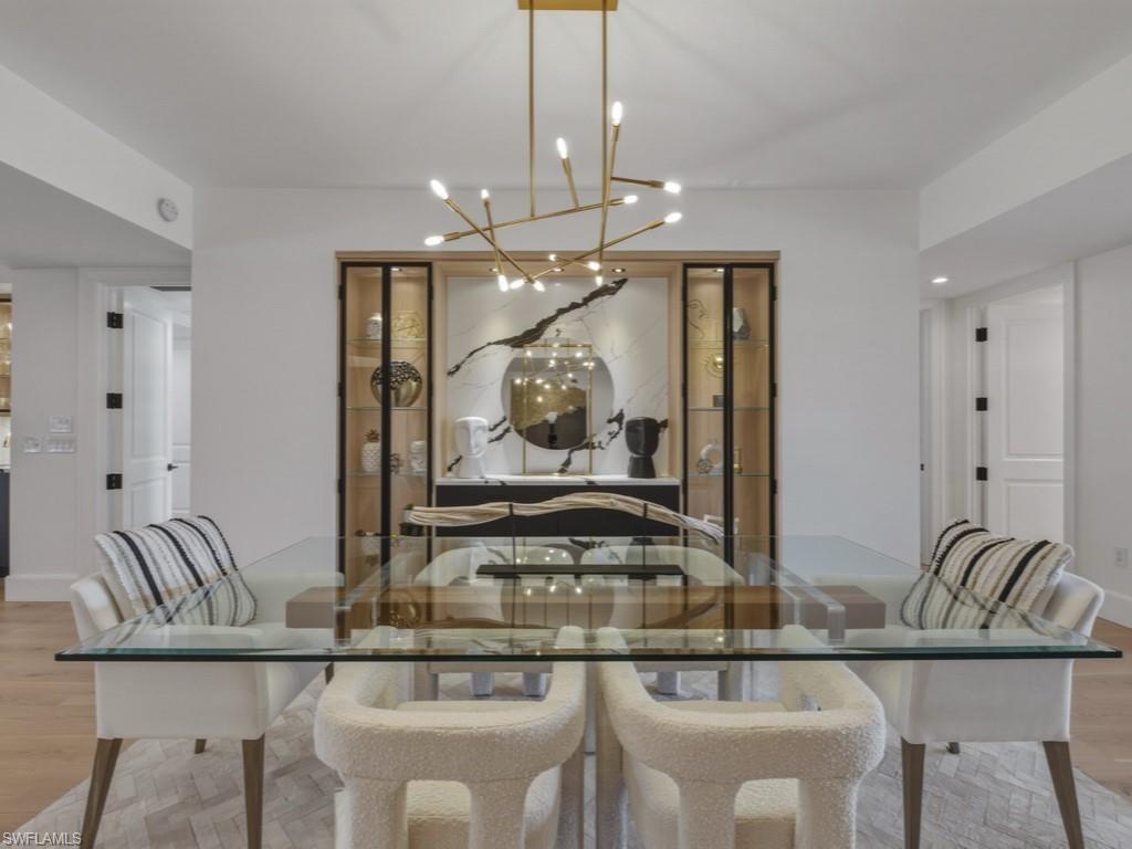 Dining room featuring light Oak floors and hanging lights