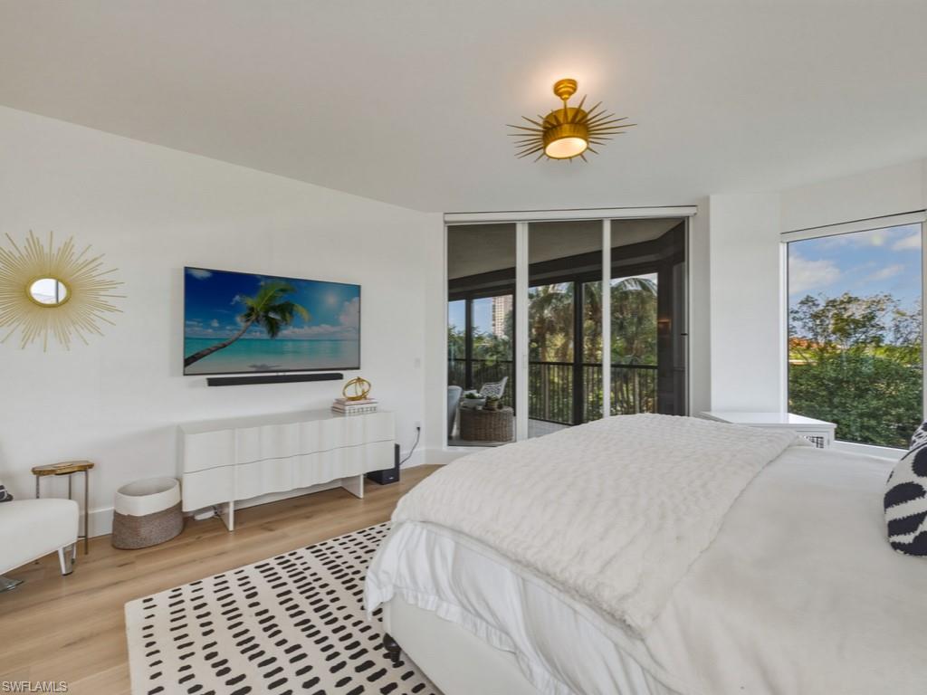 Bedroom featuring light wood finished floors and access to outside