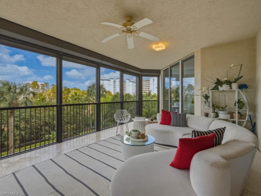 Screened lanai with expansive windows and a textured ceiling