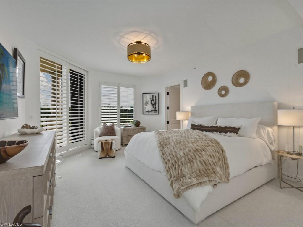 Bedroom with light carpet