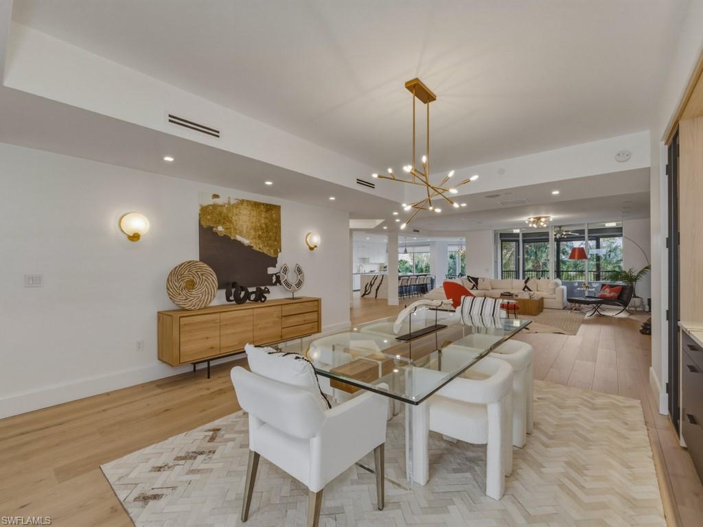 Dining room featuring hanging lights and light wood-style floors