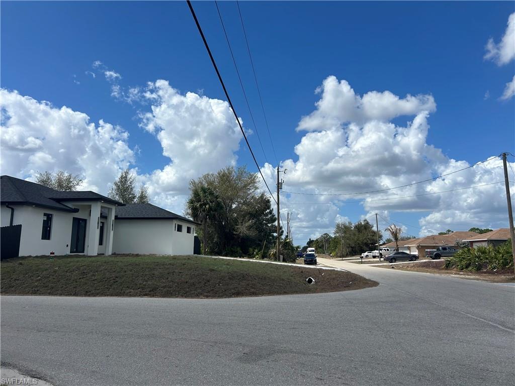 View of asphalt street featuring a residential view