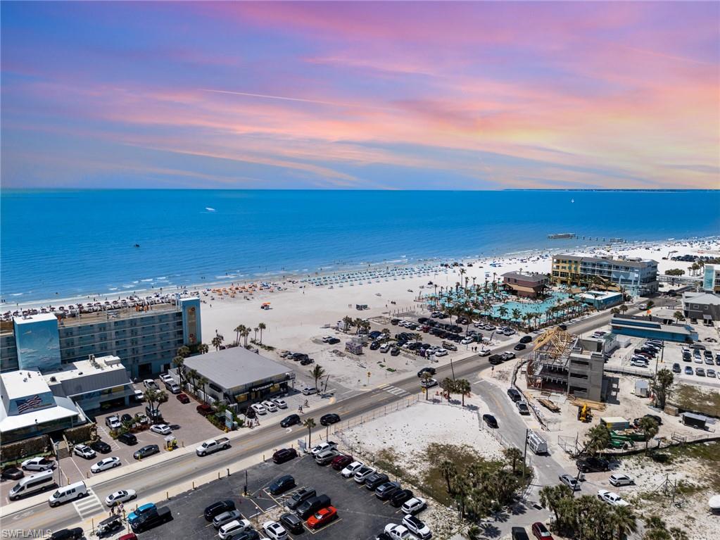Aerial view at dusk of view of water and beach