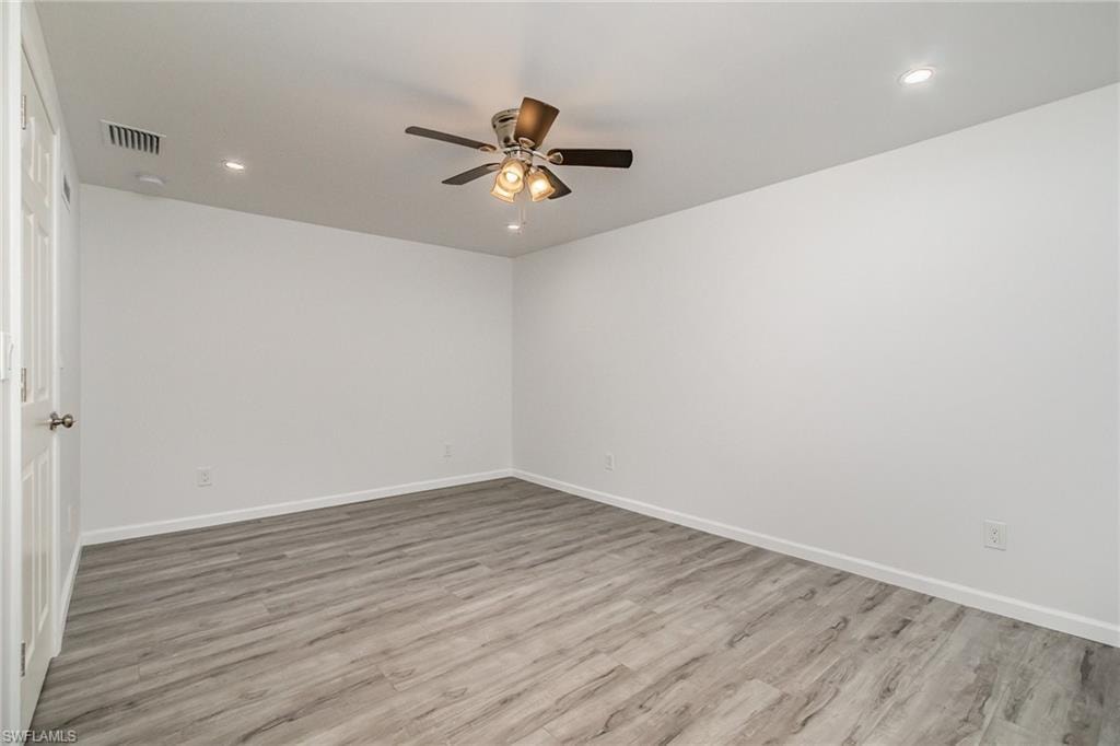 Unfurnished room with recessed lighting, ceiling fan, and light wood-style floors