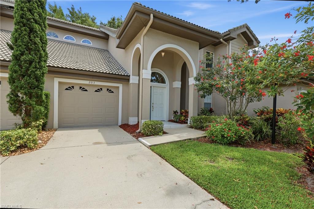Front of Coach home beautifully landscaped community pool is just across the street