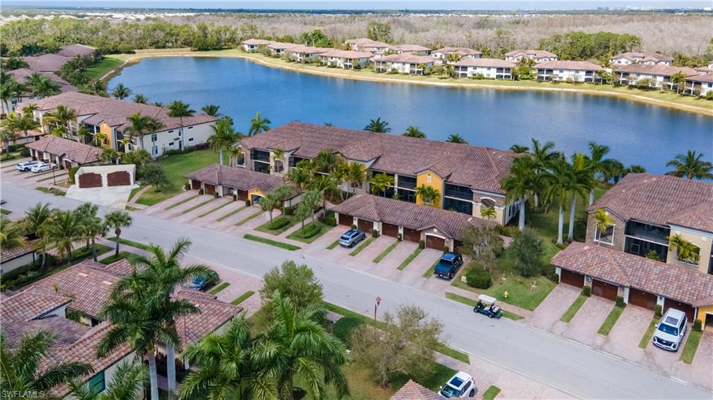Aerial perspective of suburban area with a nearby body of water