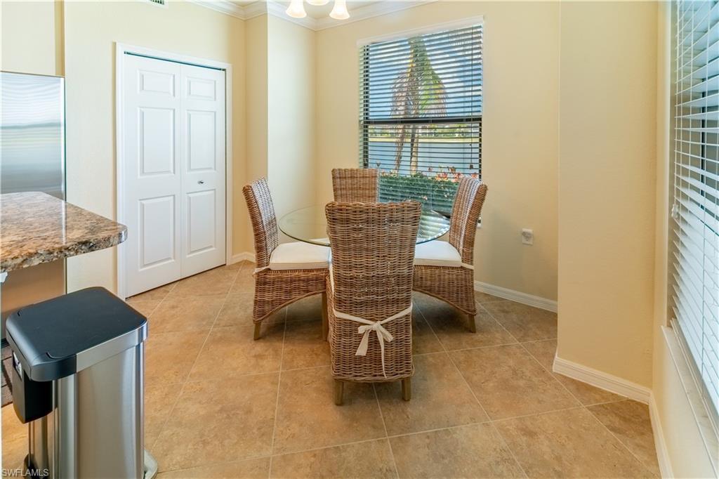 Dining room featuring crown molding and light tile patterned floors