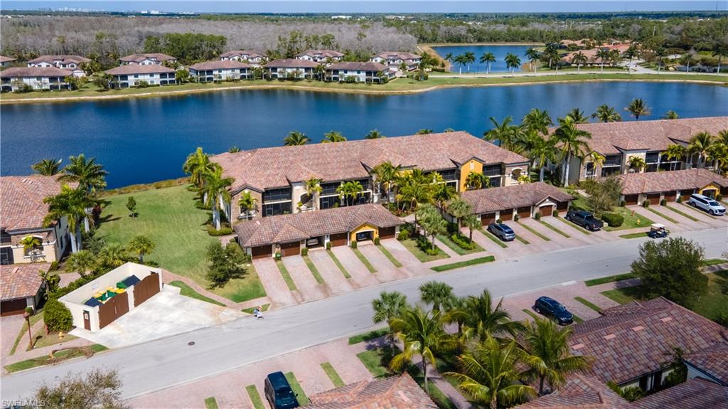 Aerial view of residential area featuring a large body of water