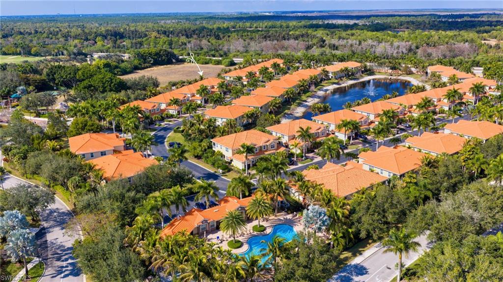 Aerial perspective of suburban area featuring a large body of water