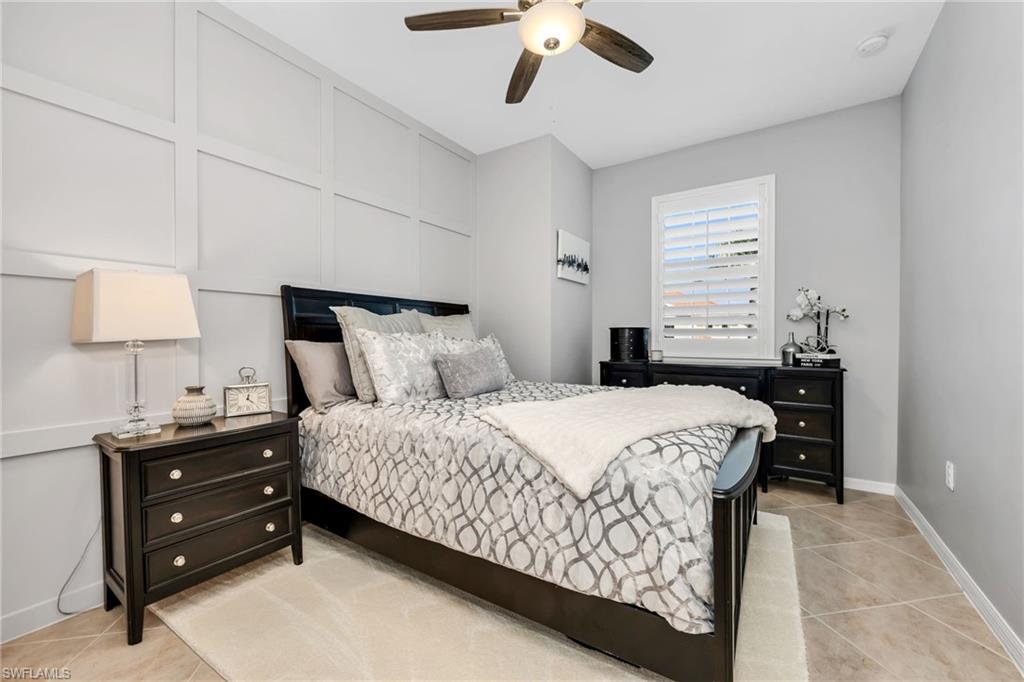 Bedroom featuring ceiling fan and light tile patterned flooring