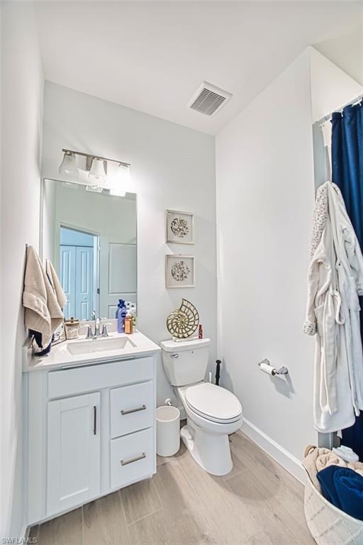 Bathroom with vanity and wood tiled floors