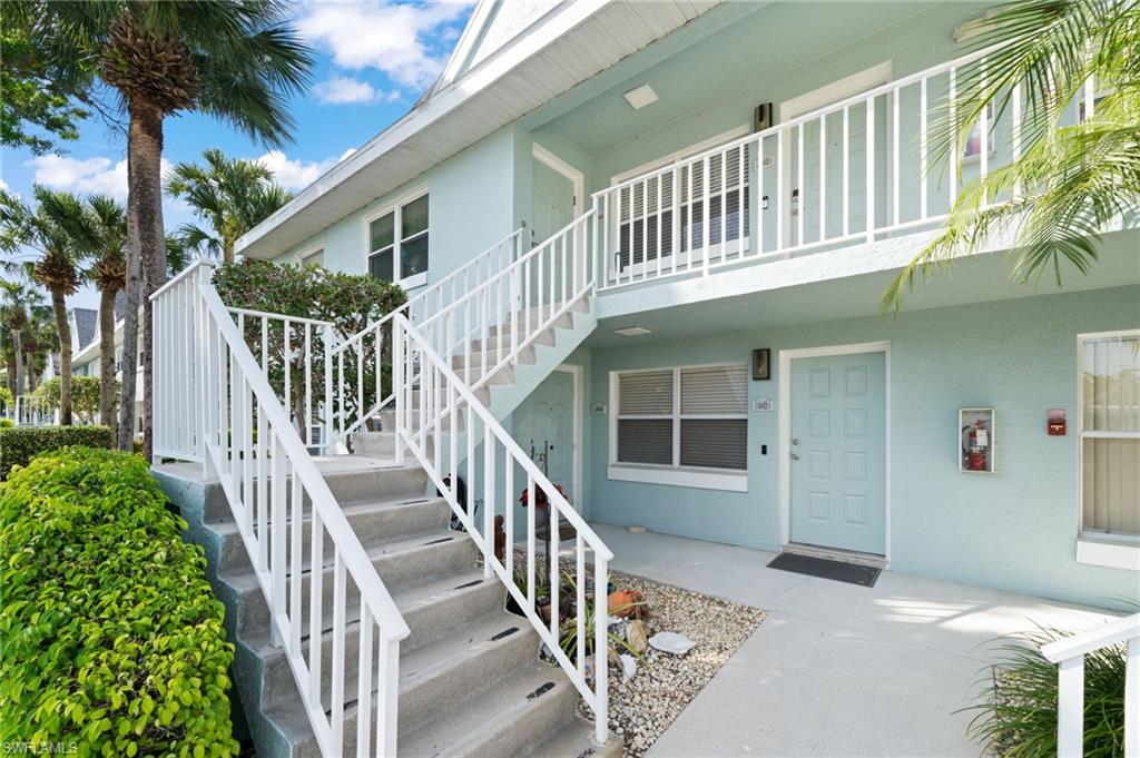 Entrance to property featuring stucco siding