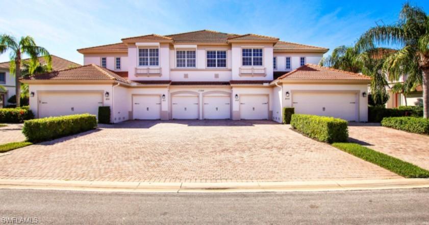 Mediterranean / spanish home featuring driveway, stucco siding, a garage, and a tiled roof
