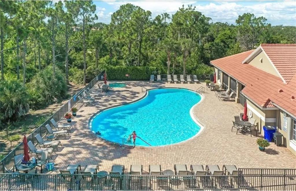 Community pool featuring a patio