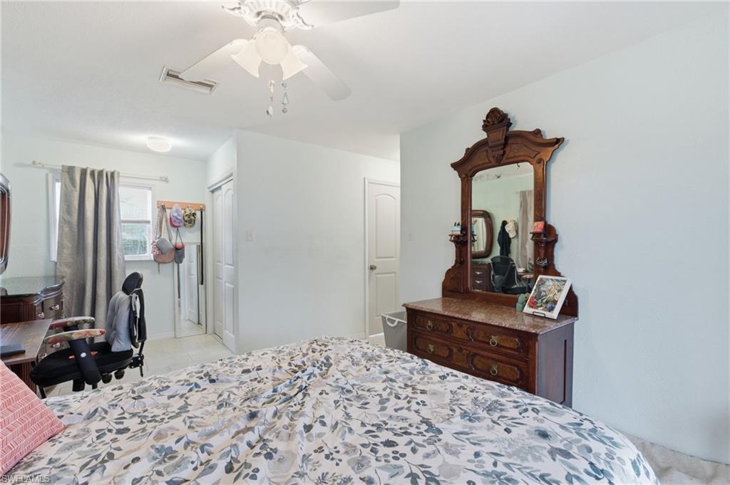 Bedroom featuring a closet and a ceiling fan