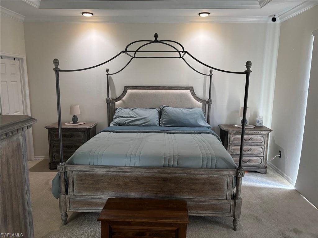 Bedroom featuring ornamental molding and carpet