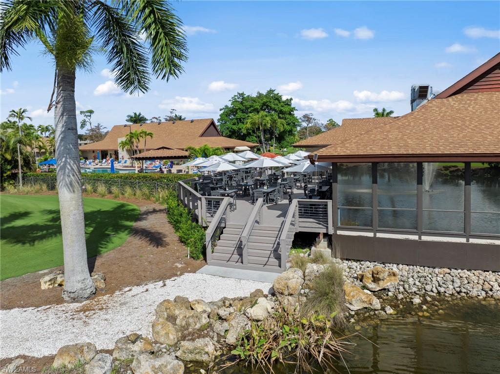 Dock area featuring a water view and a sunroom