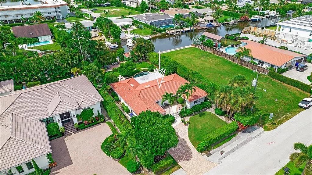 Aerial view of residential area with a large body of water