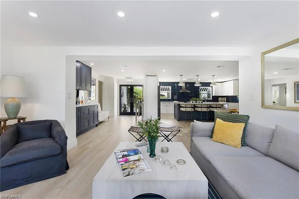 Living room featuring recessed lighting, light wood-style flooring, and french doors