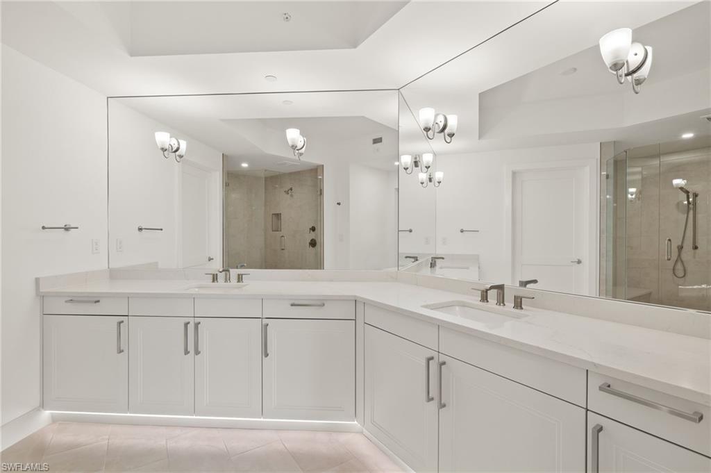 Master bath is spacious features under cabinet lights and dual sinks
