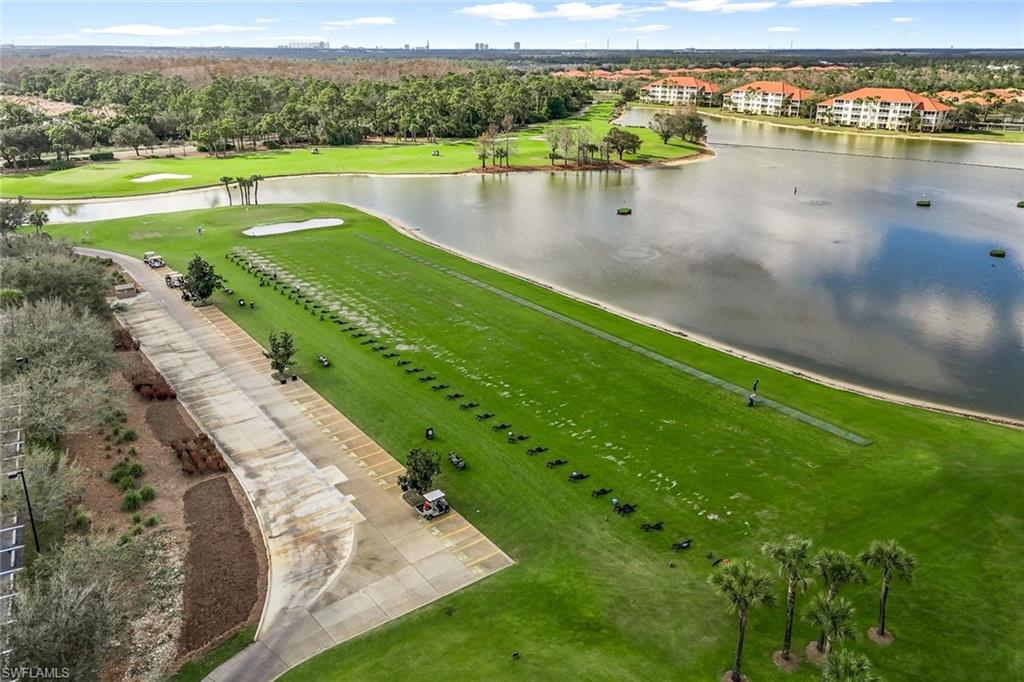 Drone / aerial view of a local golf course and a nearby body of water