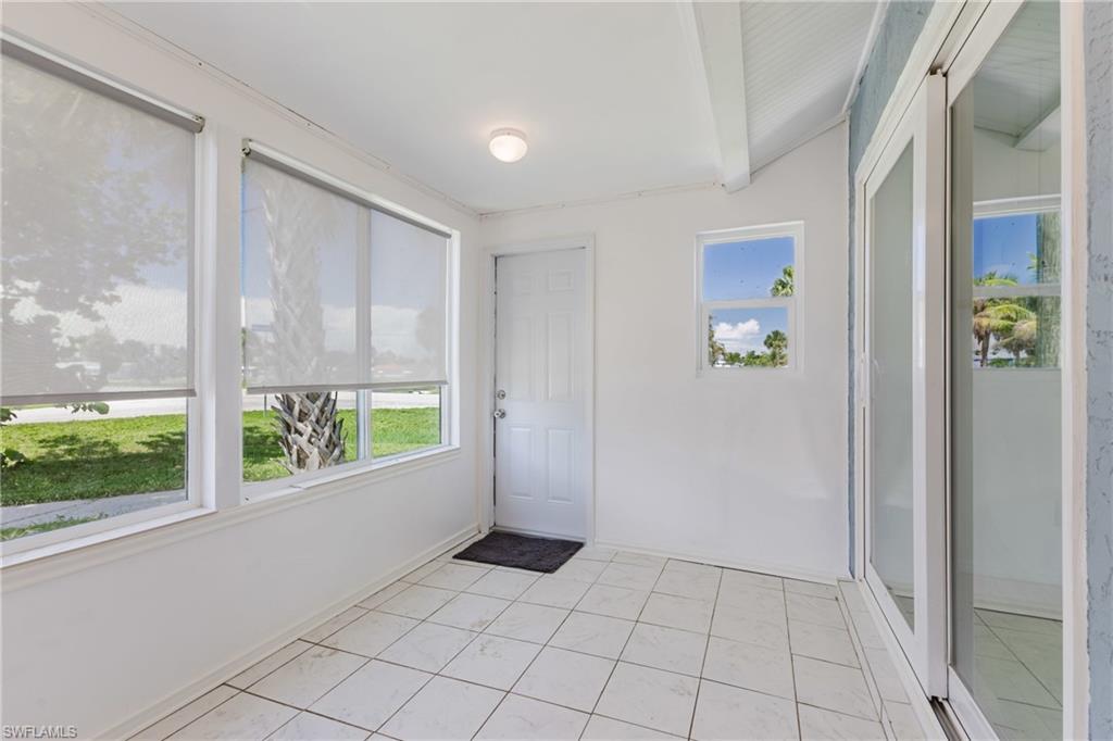 Unfurnished sunroom with healthy amount of natural light