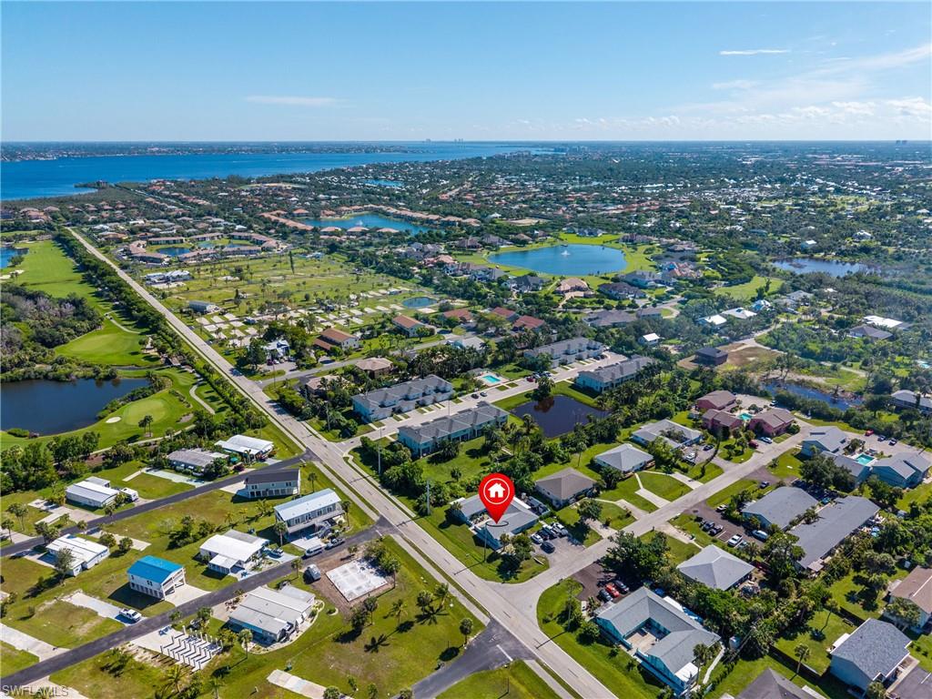 Aerial view of residential area featuring a large body of water
