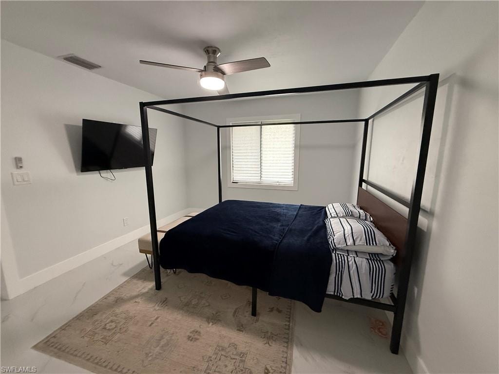 Bedroom featuring baseboards and a ceiling fan