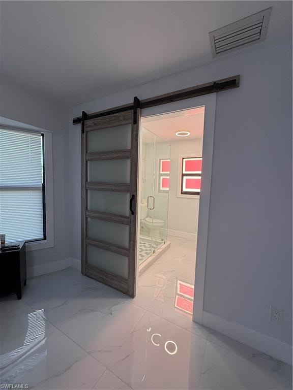 Detailed view of a barn door and baseboards