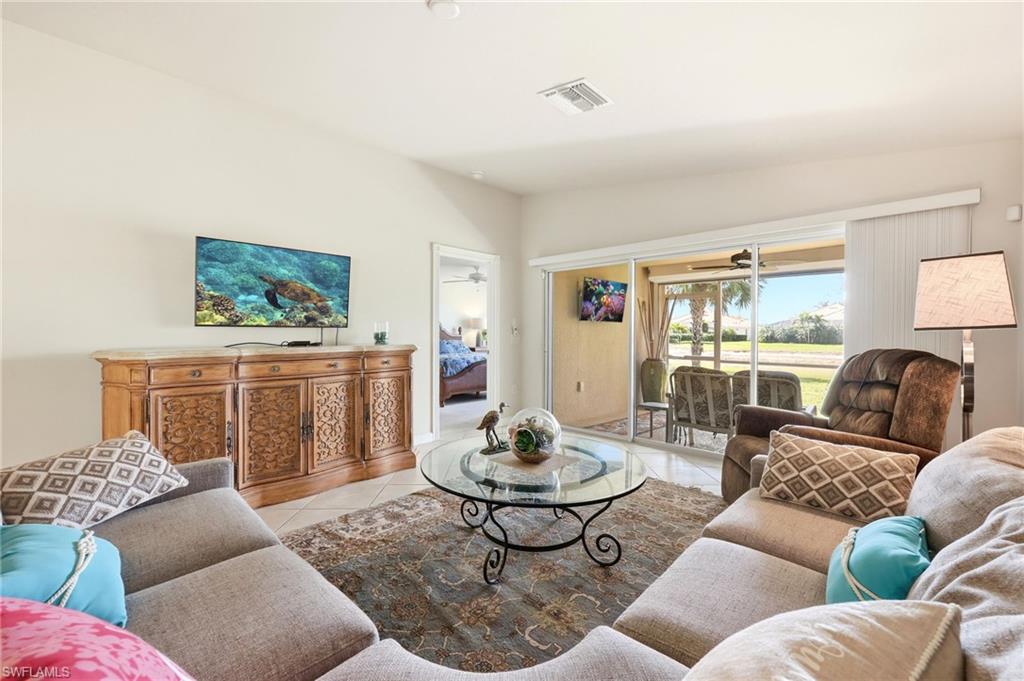 Living room with light tile patterned floors