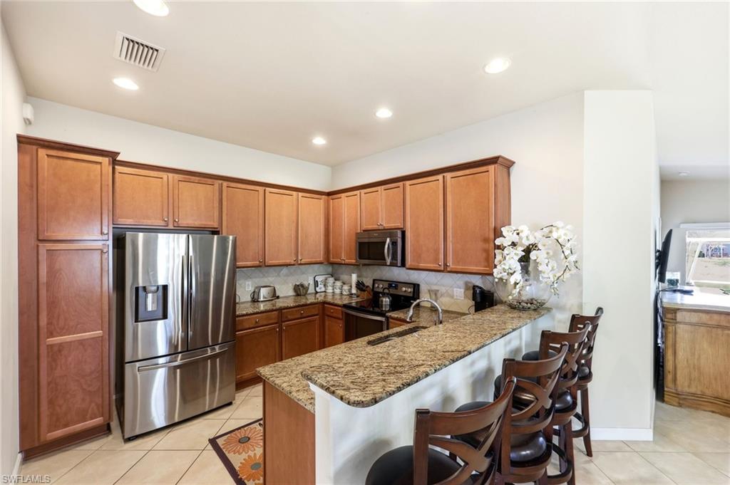 Kitchen featuring kitchen bar
