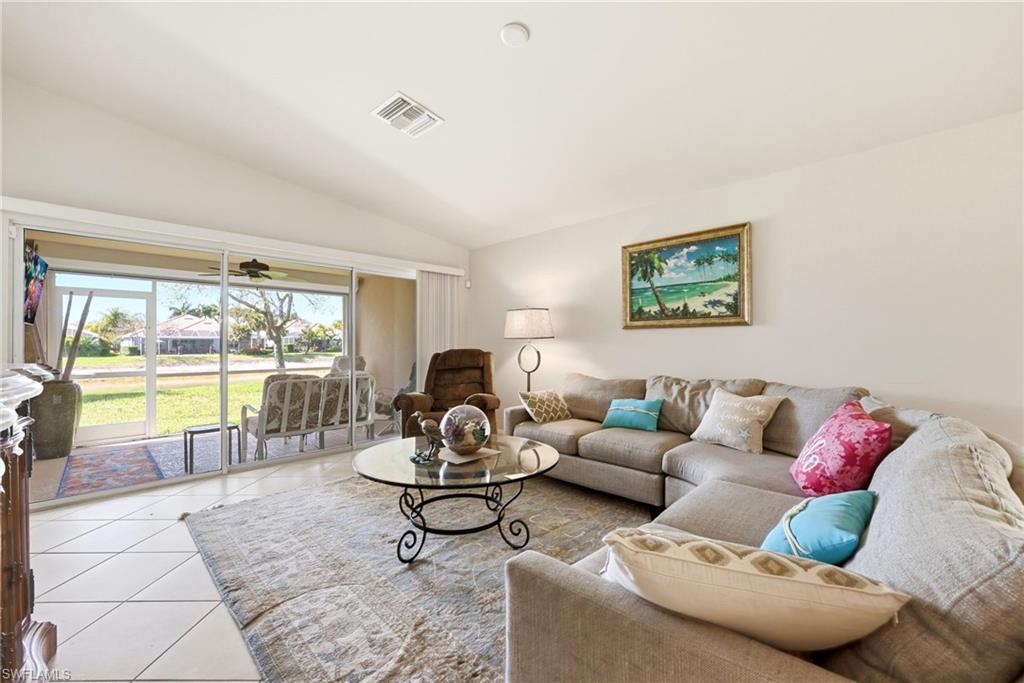 Living area featuring vaulted ceiling