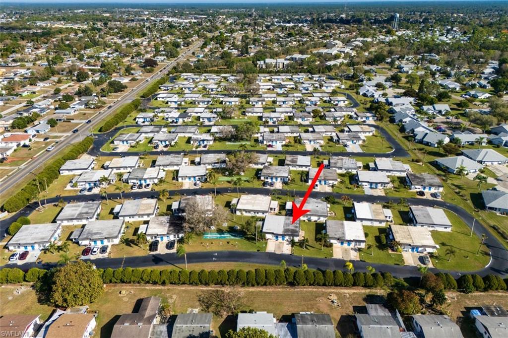 Aerial overview of property's location with nearby suburban area