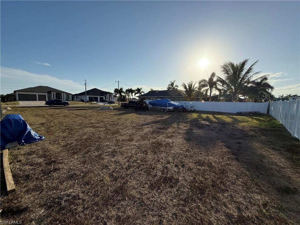 Fenced yard with a residential view