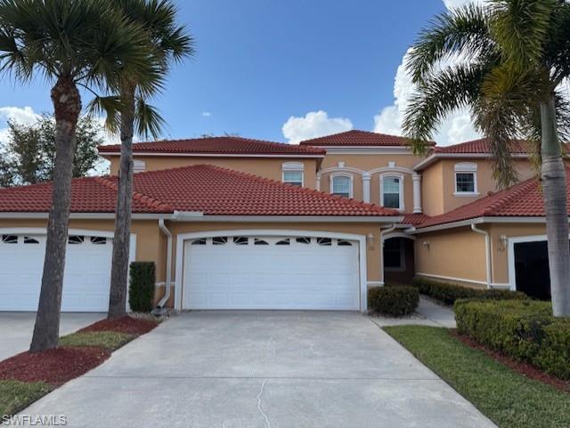 Mediterranean / spanish house featuring stucco siding, concrete driveway, a garage, and a tiled roof