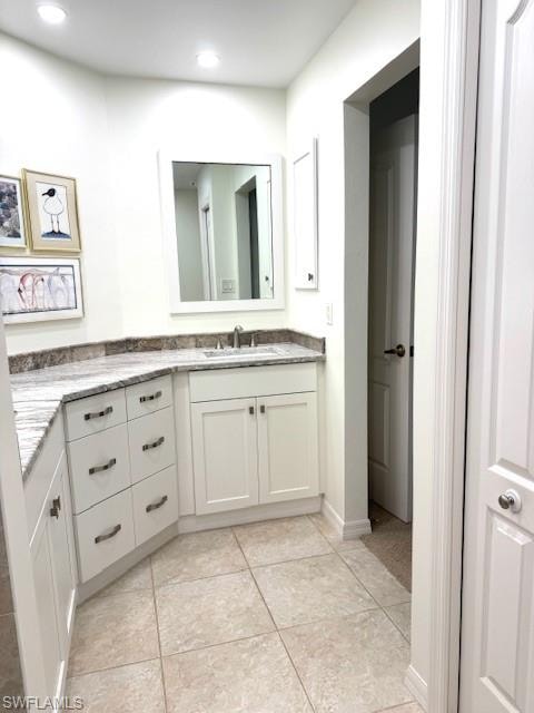 Bathroom with vanity and light tile patterned floors