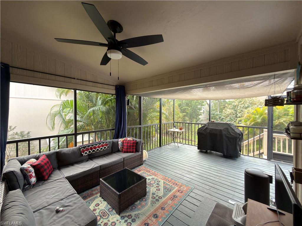 Sunroom / solarium with an outdoor lounge area, ceiling fan, lofted ceiling, and a wooden deck