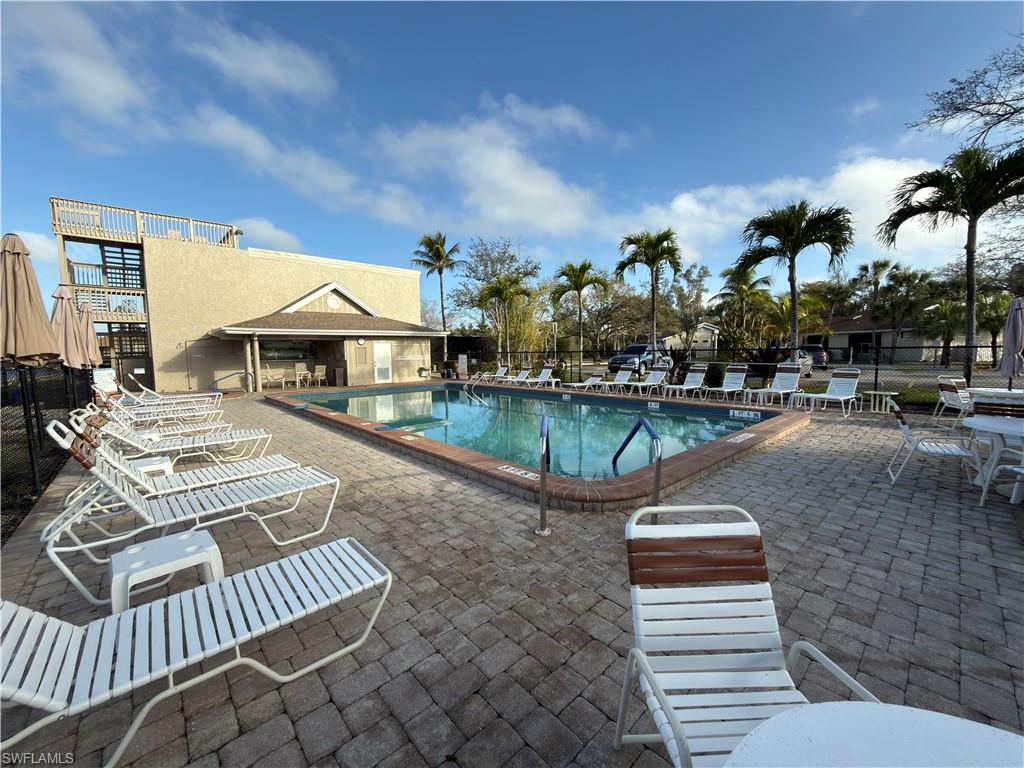 Community pool with a patio area