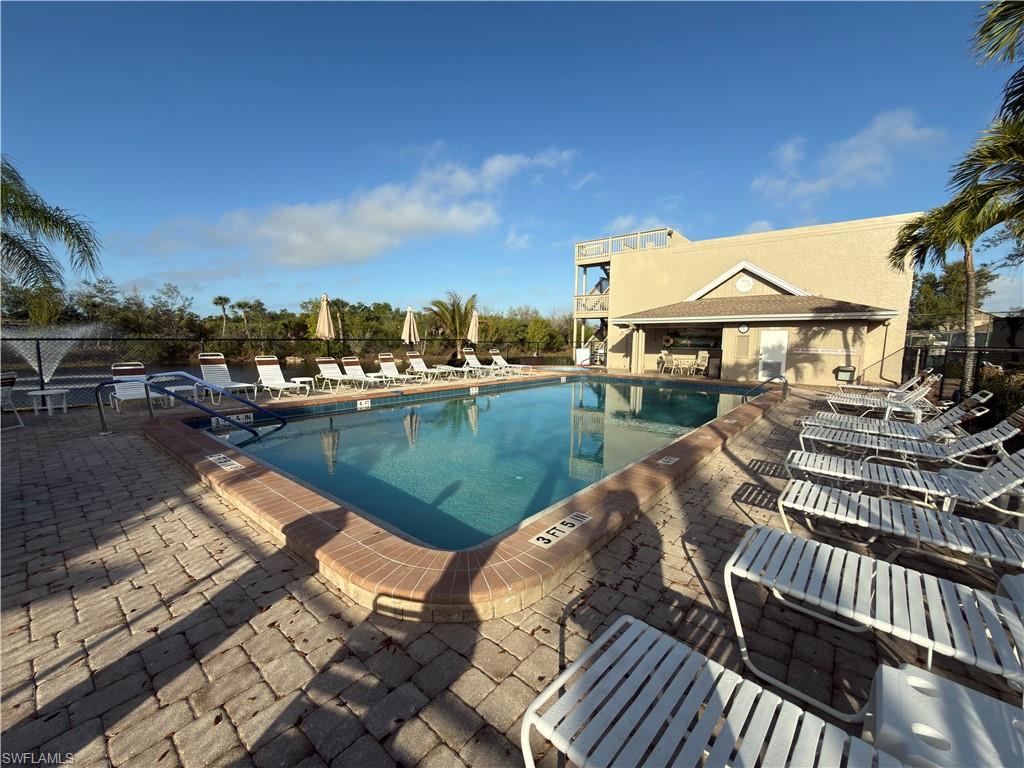 Community pool with a patio area