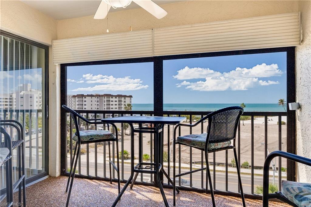 Unfurnished sunroom with a water view and a textured wall
