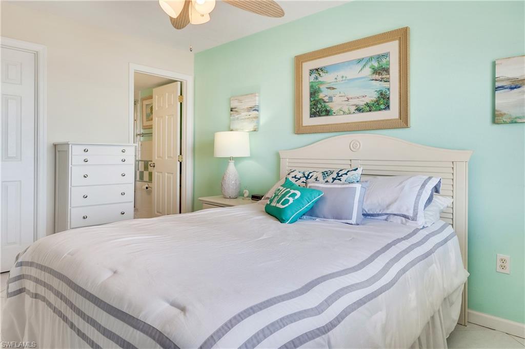 Bedroom with connected bathroom and ceiling fan